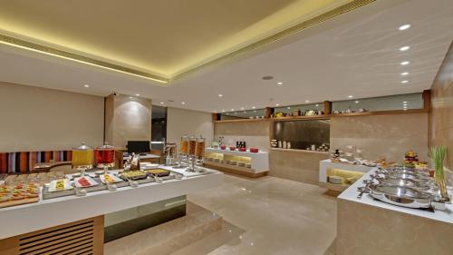 a restaurant with many different types of food on display at The Fern - Goregaon in Mumbai