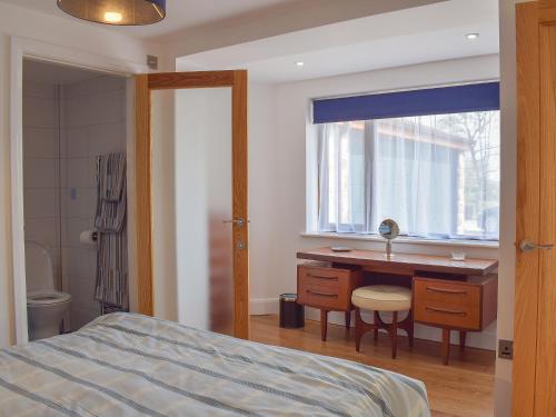 A bed or beds in a room at Lower Barns Fold 