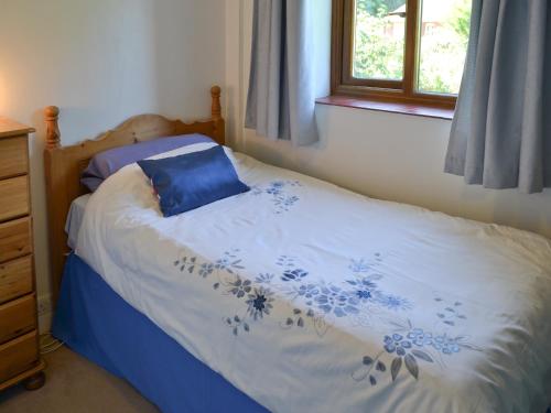 A bed or beds in a room at Brambles 