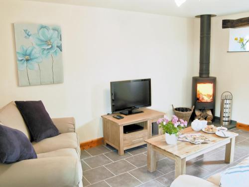 A television and/or entertainment center at The Cowshed 