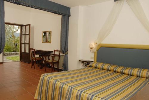 Ein Bett oder Betten in einem Zimmer der Unterkunft Relais Borgo Di Toiano