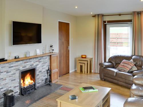 A television and/or entertainment center at Balnowart Bungalow 