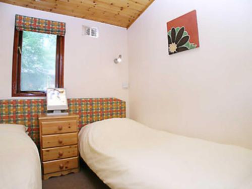 
A bed or beds in a room at Cabin 73
