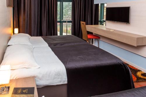 Ліжко або ліжка в номері Hotel S