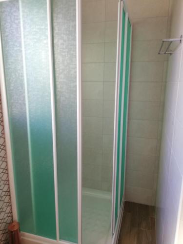 a shower with a glass door in a bathroom at Chicos Studios in Ayia Napa