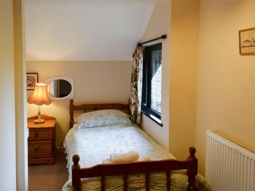 A bed or beds in a room at Moles Acre 