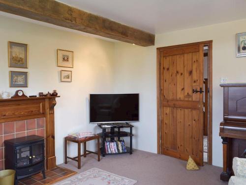 A television and/or entertainment center at Cardinal Cottage 