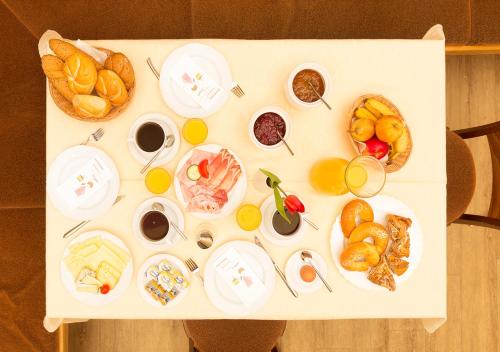 a table with different types of food on it at Hotel Brunnwirt in Weissbriach