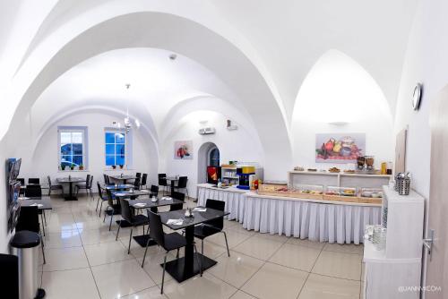 En restaurant eller et andet spisested på Hotel U Tří hrušek suites & apartments