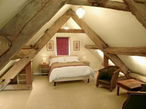 A bed or beds in a room at The Old Mill 