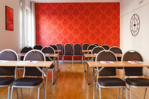 a classroom with rows of desks and chairs at Best Western Plaza Hotel in Eskilstuna