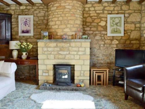 A television and/or entertainment center at Sundial Cottage 