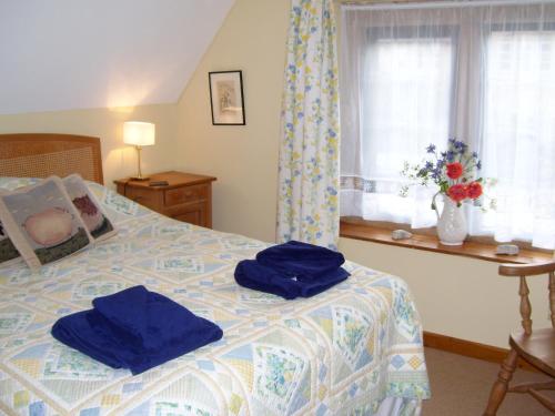 A bed or beds in a room at The Lodge 