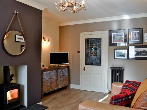 A television and/or entertainment center at Cresecent Cottage 