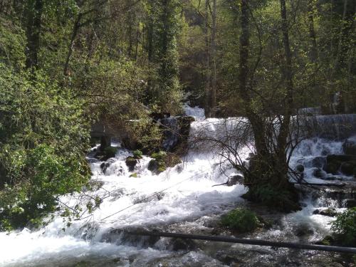 a stream of water with snow on the ground at Viola i Detelina Apartments in Perućac