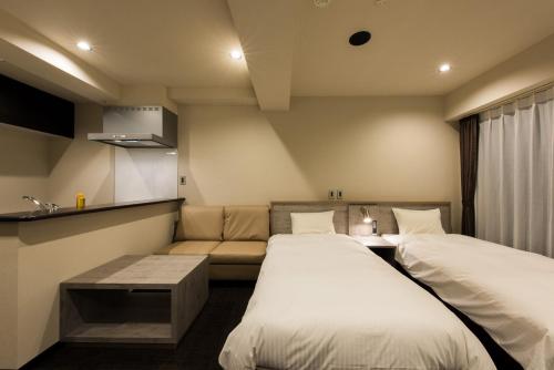 Cama o camas de una habitación en INOVA Kanazawa