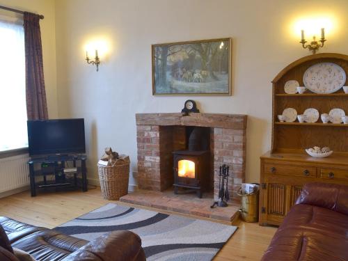 A television and/or entertainment center at Guild Cottage 