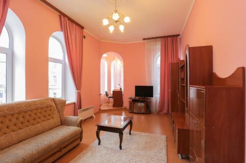 a living room with a couch and a table at Grata Apartments - Kiev in Kyiv