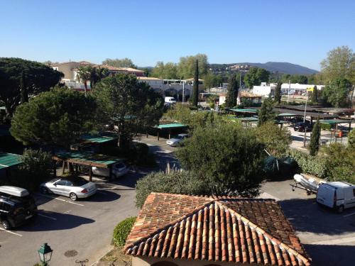 an overhead view of a parking lot with a building at Romance in Port Grimaud in Grimaud