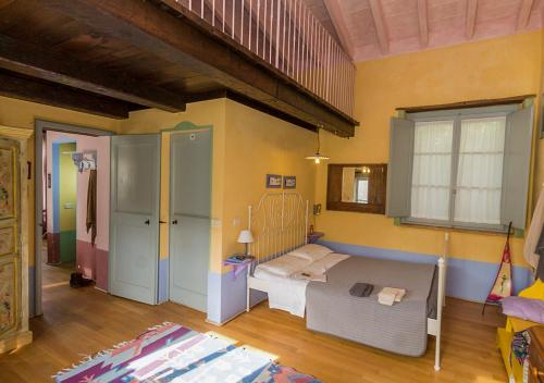 Postel nebo postele na pokoji v ubytování Agriturismo La Fonte