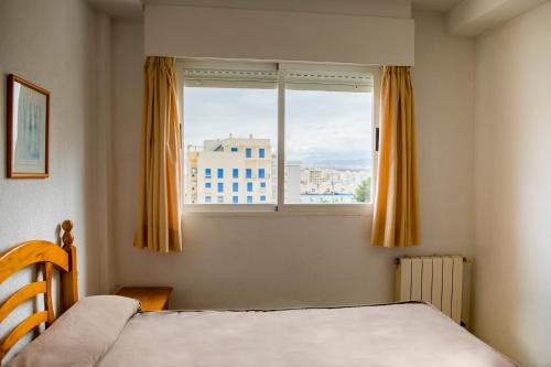 Postel nebo postele na pokoji v ubytování Apartamentos Turisticos Biarritz - Bloque I