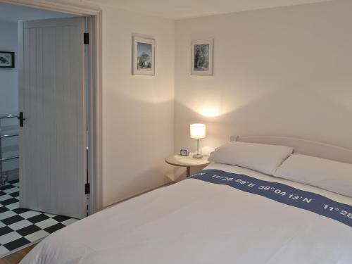 A bed or beds in a room at The Bothy 