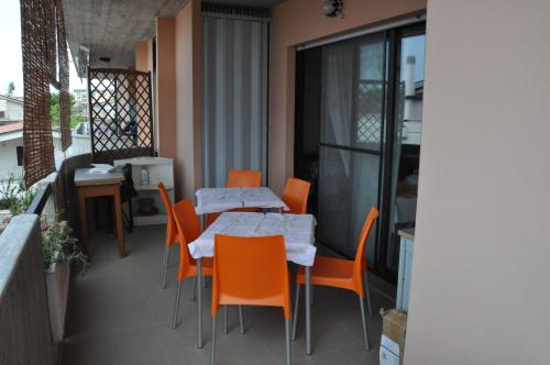 a balcony with a table and chairs on a balcony at Bed & Breakfast Oasi in Pescara