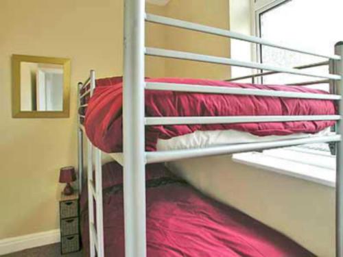 A bunk bed or bunk beds in a room at The Beach Hut 