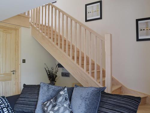 A bed or beds in a room at Pottles Annexe 