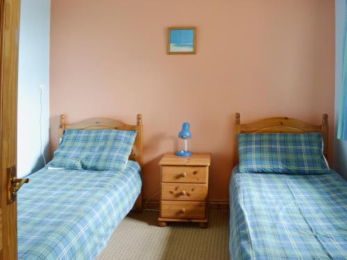 A bed or beds in a room at The Hay Barn 