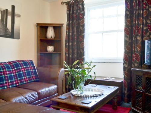 A seating area at Toffeepot Cottage 