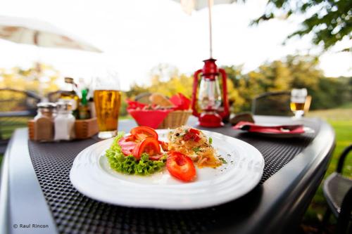 a plate of food on top of a table at Penzion Fousek in Zvíkovské Podhradí