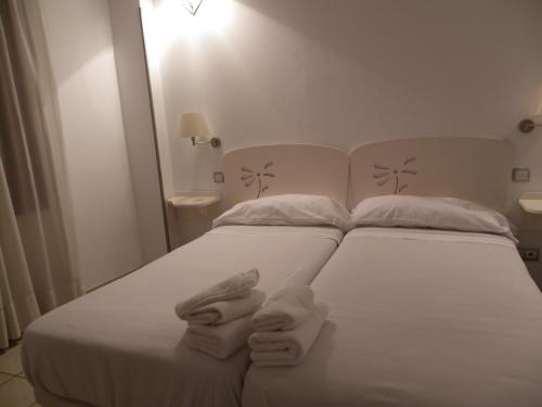 Postel nebo postele na pokoji v ubytování Hostal Sierra