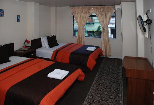 Llit o llits en una habitació de Hotel Bonaventure