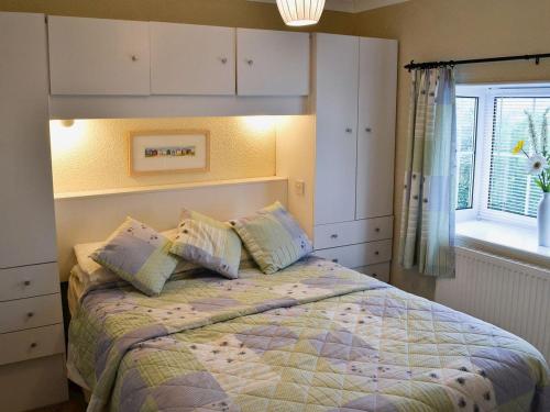 A bed or beds in a room at Adelin Lodge 