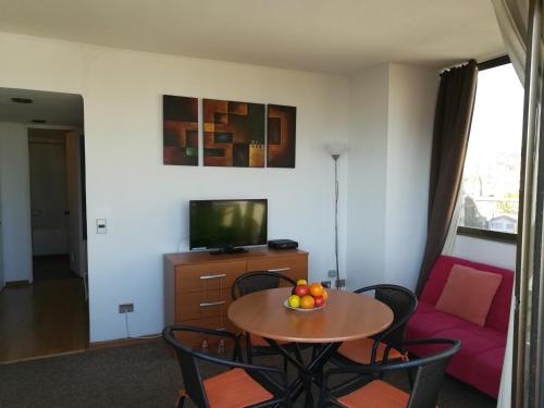 TV a/nebo společenská místnost v ubytování Edificio Maya