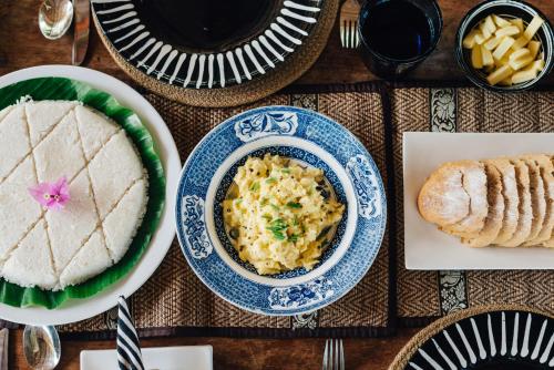 a table topped with plates of food and desserts at Luna Laguna in Kalpitiya