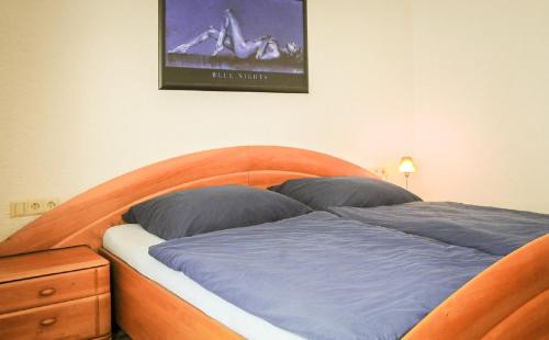 מיטה או מיטות בחדר ב-Ferienwohnung Klenk
