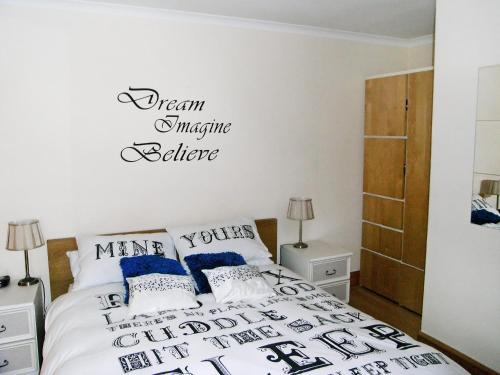 A bed or beds in a room at Nevis Let 