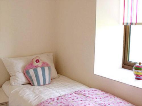 A bed or beds in a room at Elderberry 