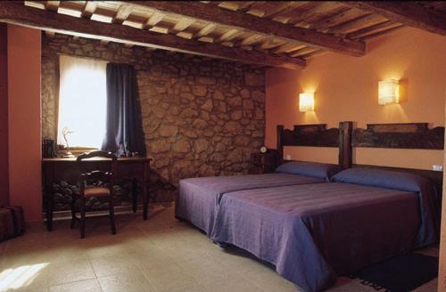 מיטה או מיטות בחדר ב-Casa Cabots