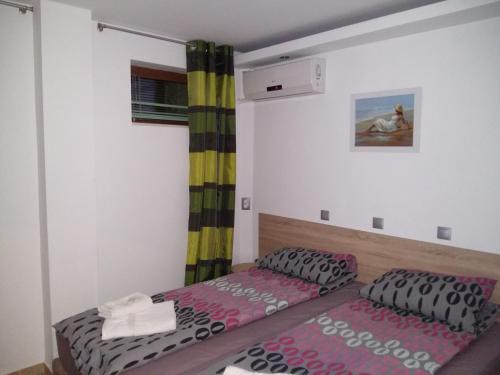 a small bedroom with a bed at Guest House Harmony in Veliko Tŭrnovo