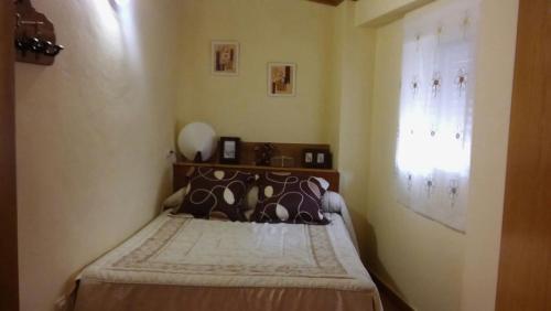 A bed or beds in a room at Casa Rural Arroyofrio Riópar