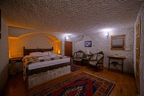 Katil atau katil-katil dalam bilik di Melek Cave Hotel