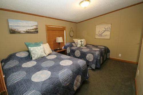 a hotel room with two beds in a room at Island Club #80 in Put-in-Bay