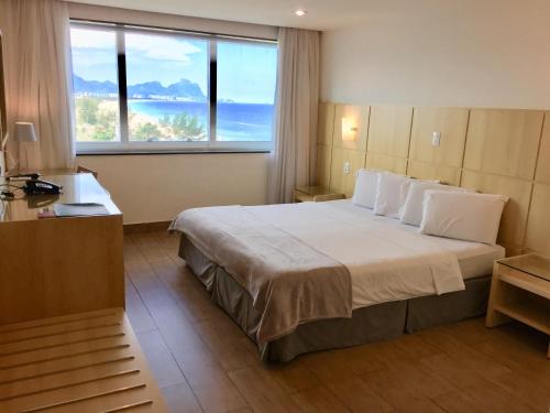 Кровать или кровати в номере Atlantico Sul Hotel