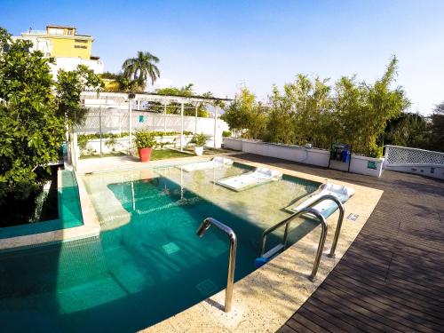 a swimming pool on top of a building at Placita Vieja Hotel Boutique Spa in Santa Marta