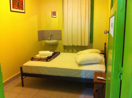 Ένα ή περισσότερα κρεβάτια σε δωμάτιο στο Zeus Hostel