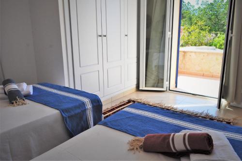 Ένα ή περισσότερα κρεβάτια σε δωμάτιο στο Siamoformentera Valentina