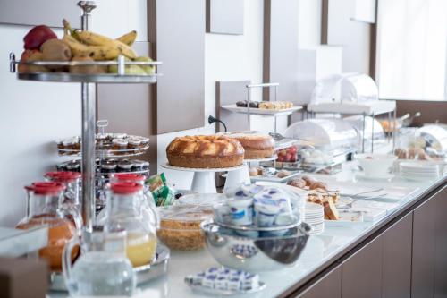 a buffet with a lot of food on a table at Hotel San Pietro in Naples